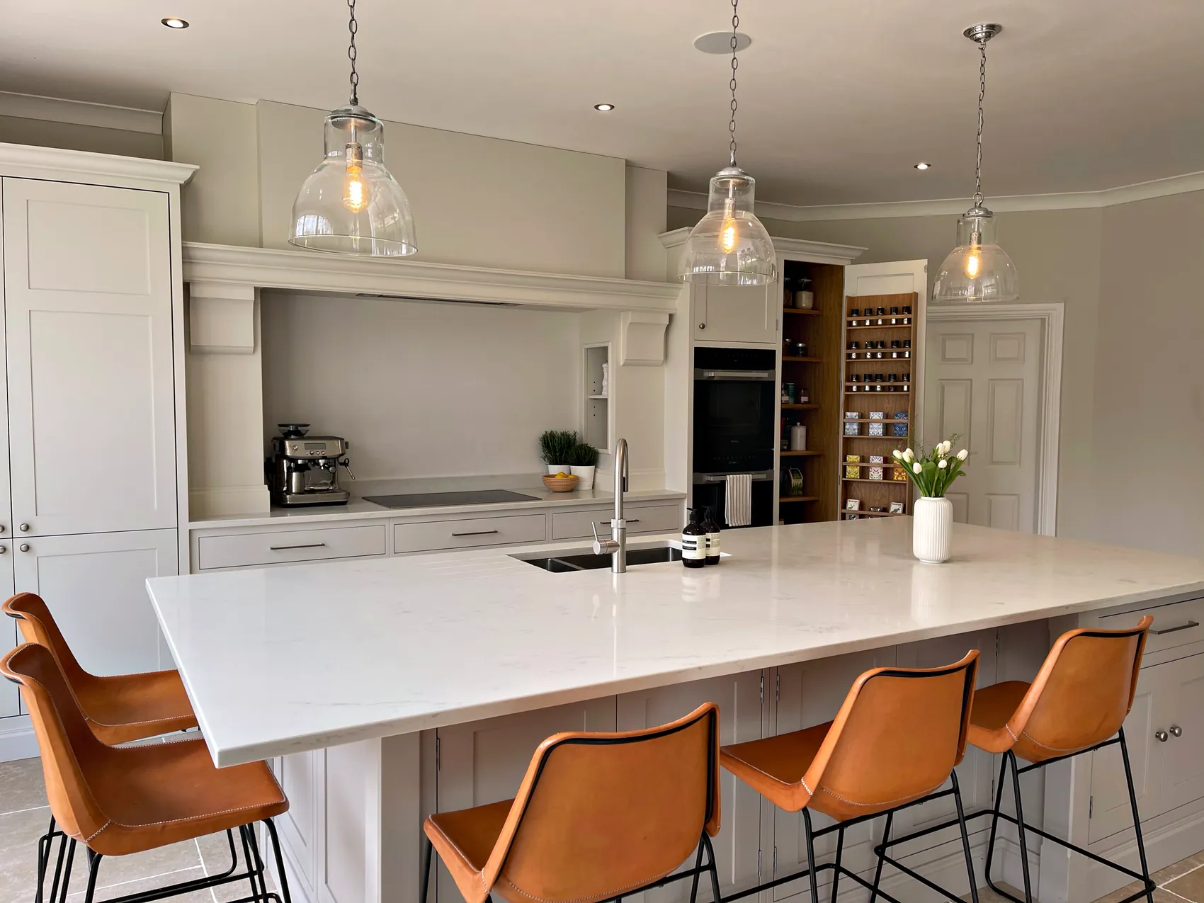 Birds Hill island under glass pendants with the bespoke larder beyond