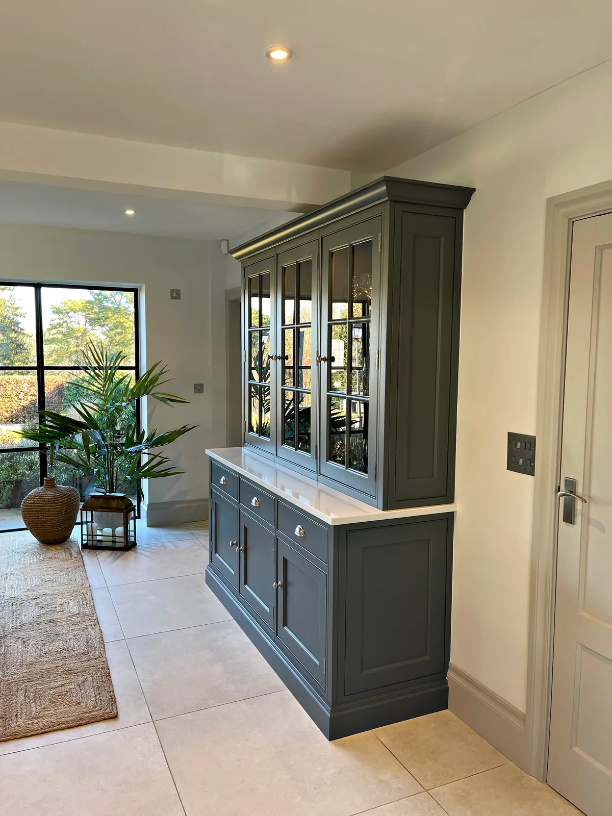 Glazed dresser painted in Downpipe in the dining area