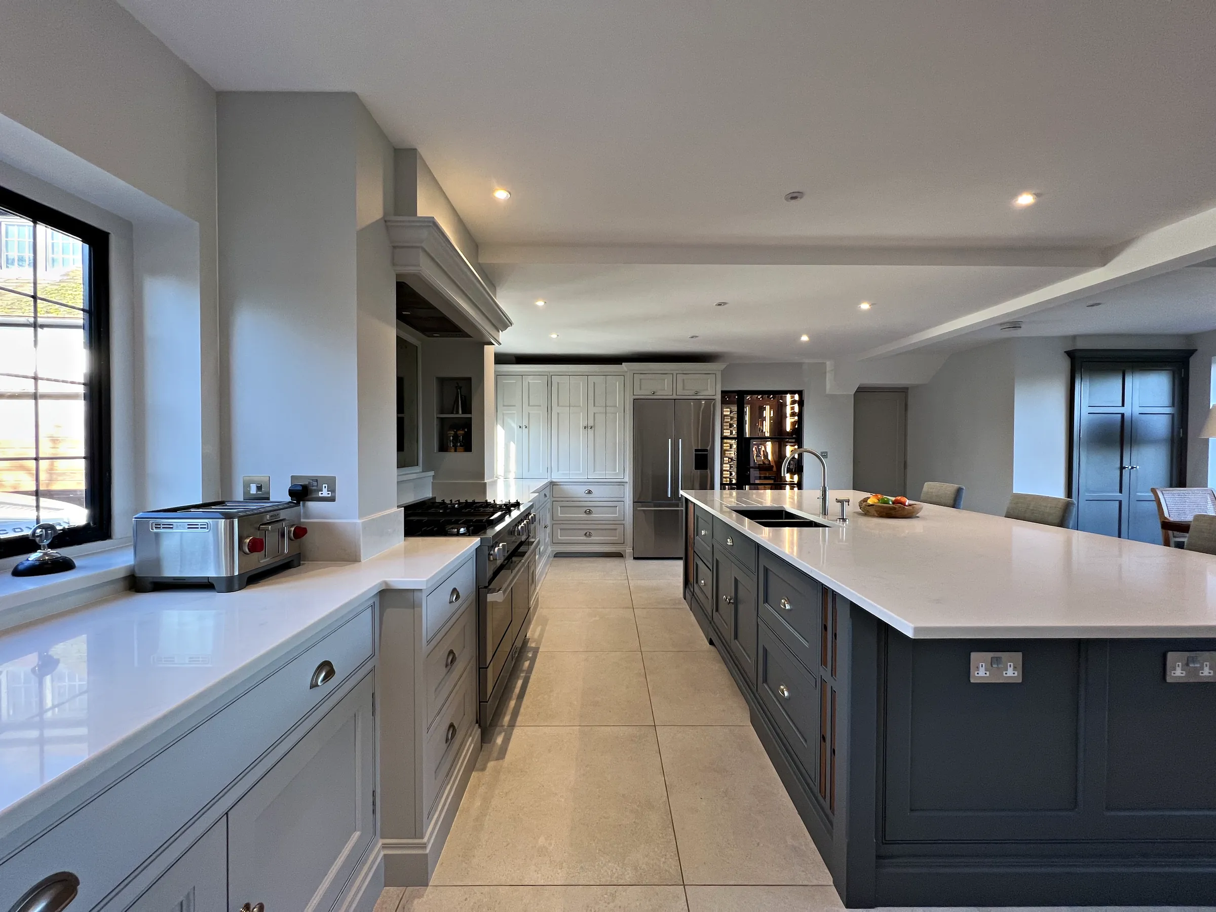 Downend kitchen painted in Pavilion Grey with a Downpipe island and white quartz worktops