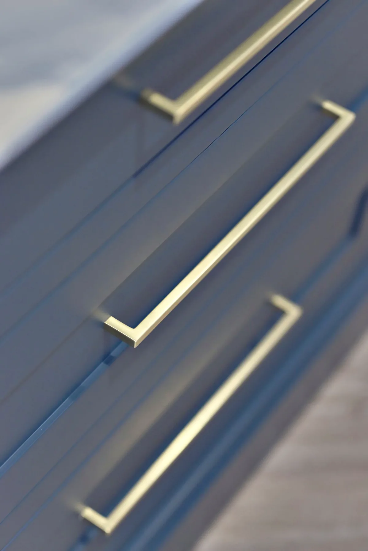 Brass bar handles on Hague Blue drawers