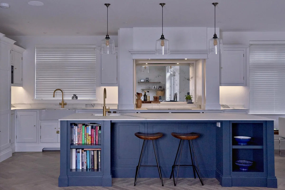 Malbrook kitchen in All White with a Hague Blue island, bookshelves and leather stools