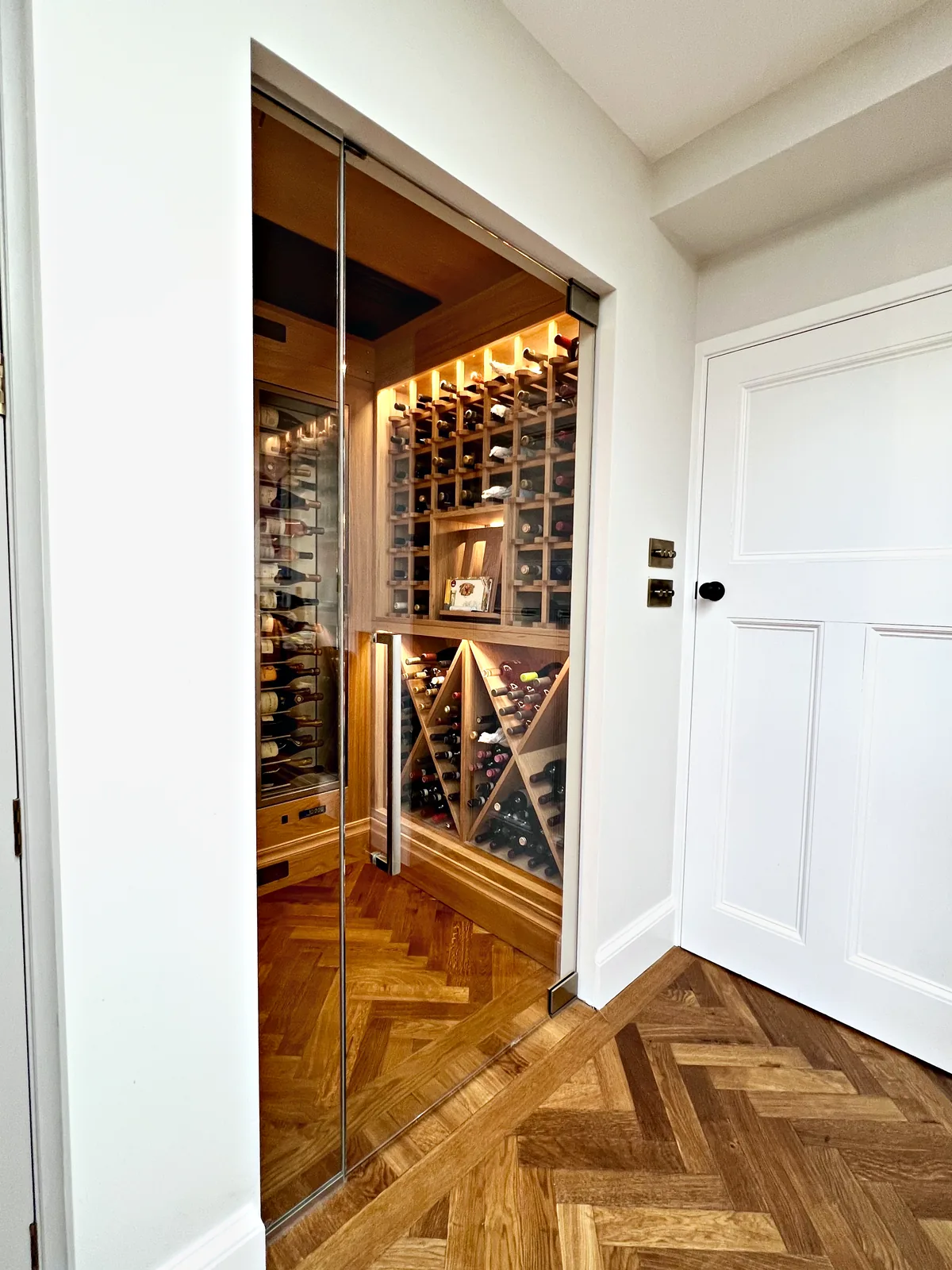 Glass door into the oak wine room