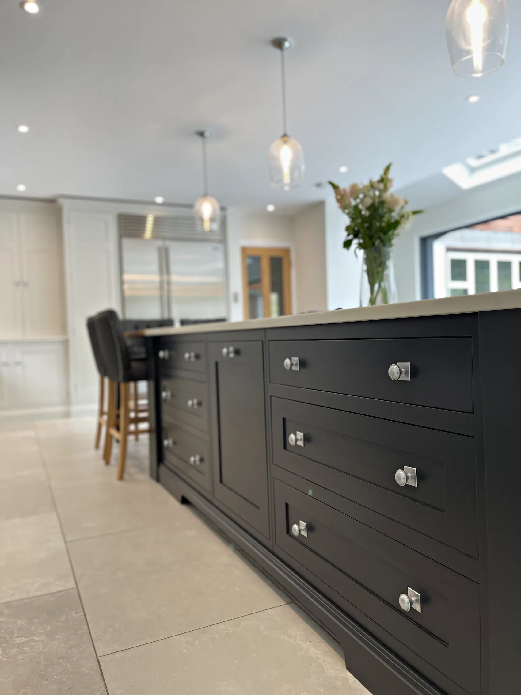 Deep in frame drawers in the Off Black island with polished nickel knobs