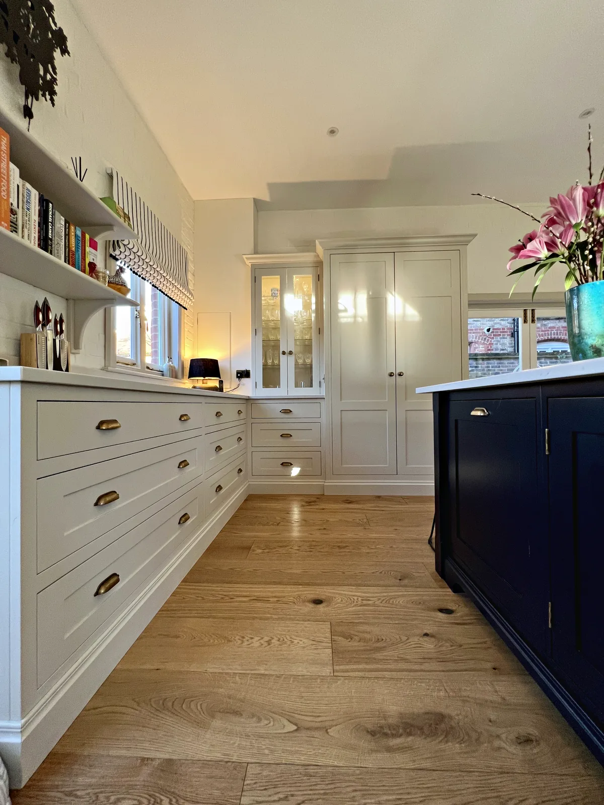 Long run of drawers with antique brass cup handles