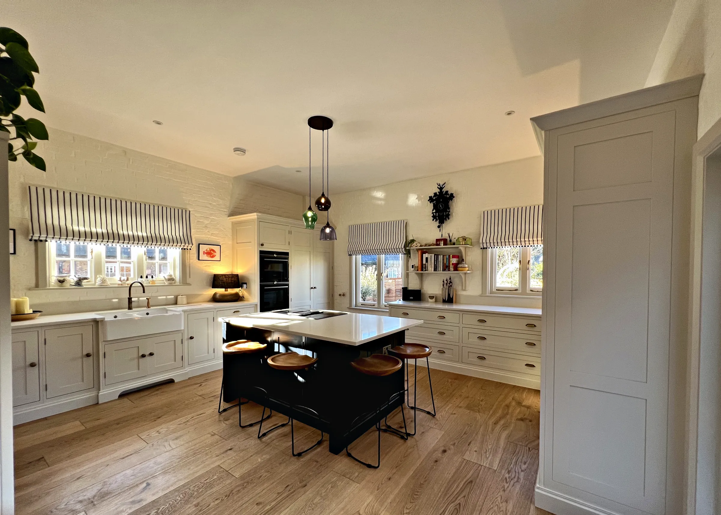 Old Hospital House kitchen in Shaded White with a Plimsoll island and oak floor