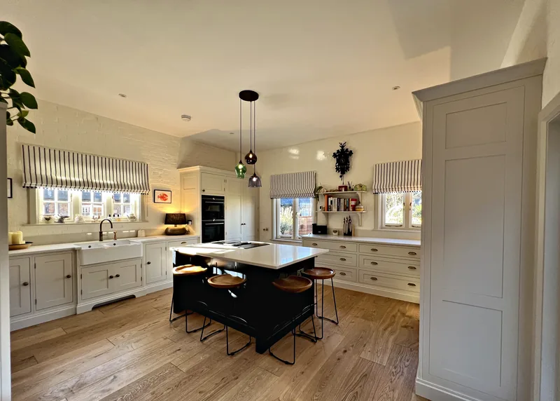 Old Hospital House kitchen in Shaded White with a Plimsoll island and oak floor