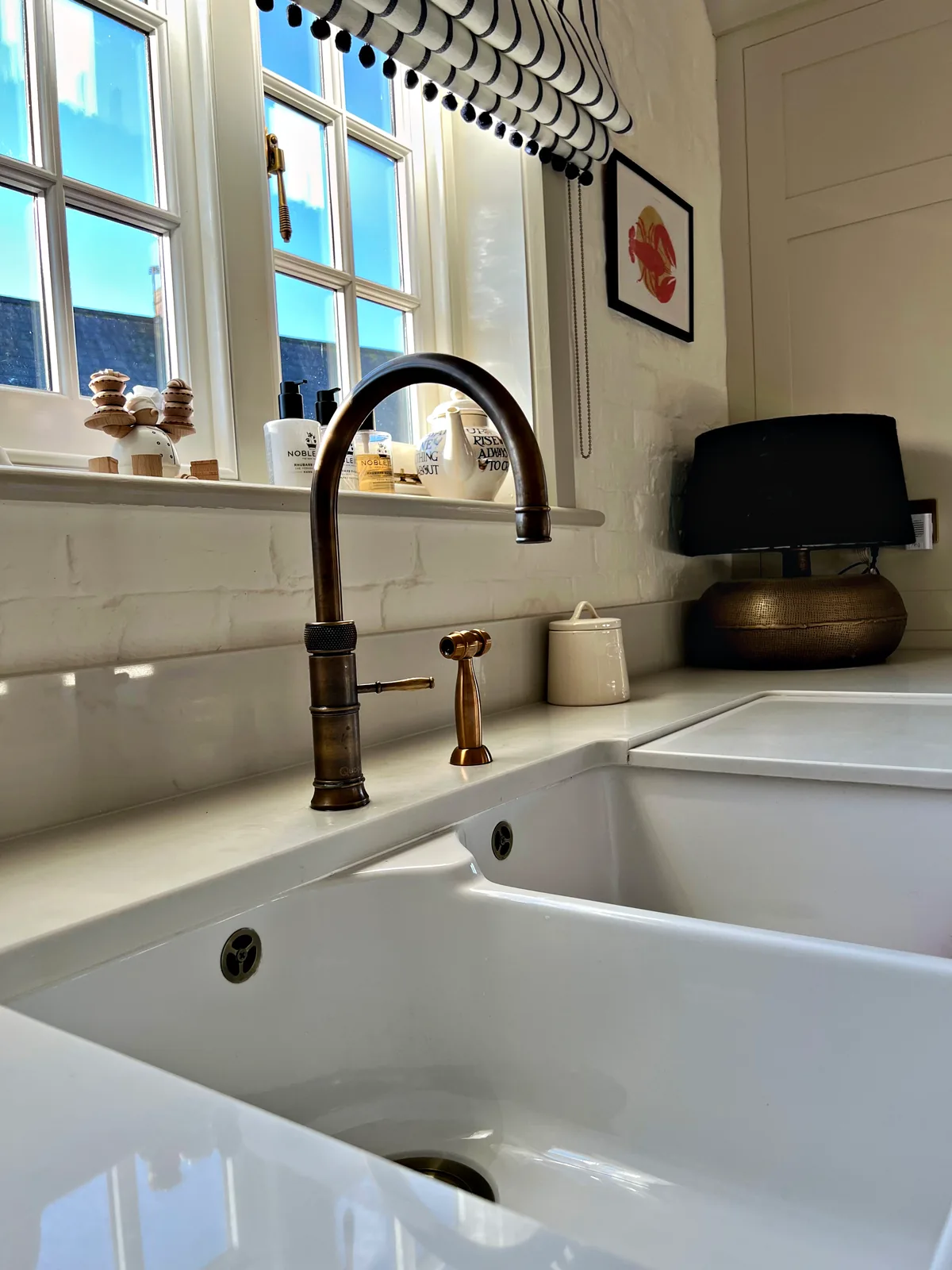 Brass Quooker tap over a twin ceramic sink